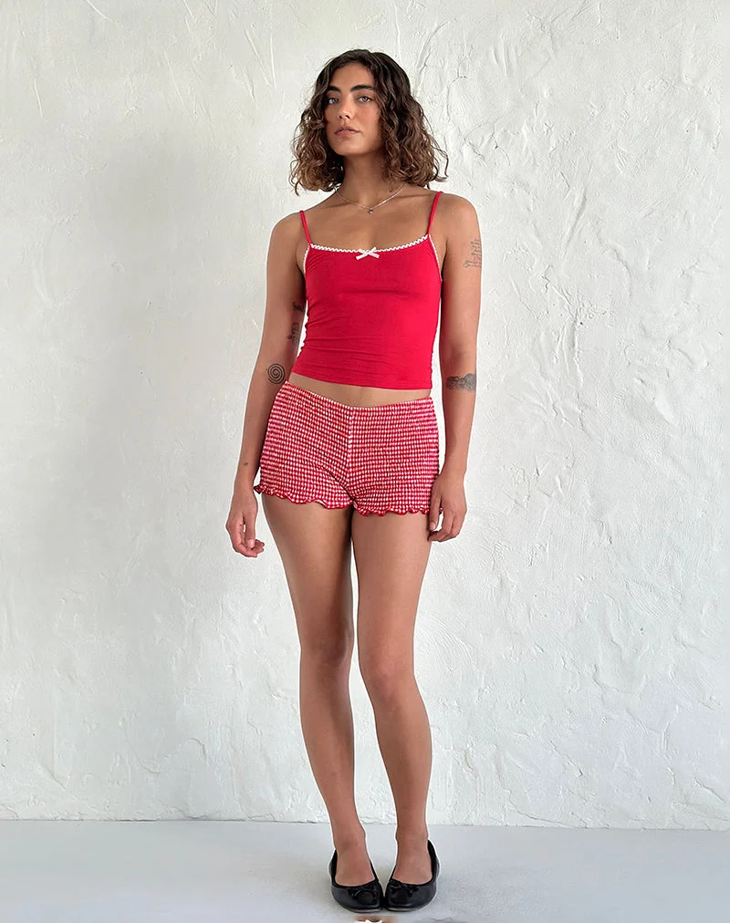 Suna Vest Top in Tangorot mit elfenbeinfarbenem Besatz